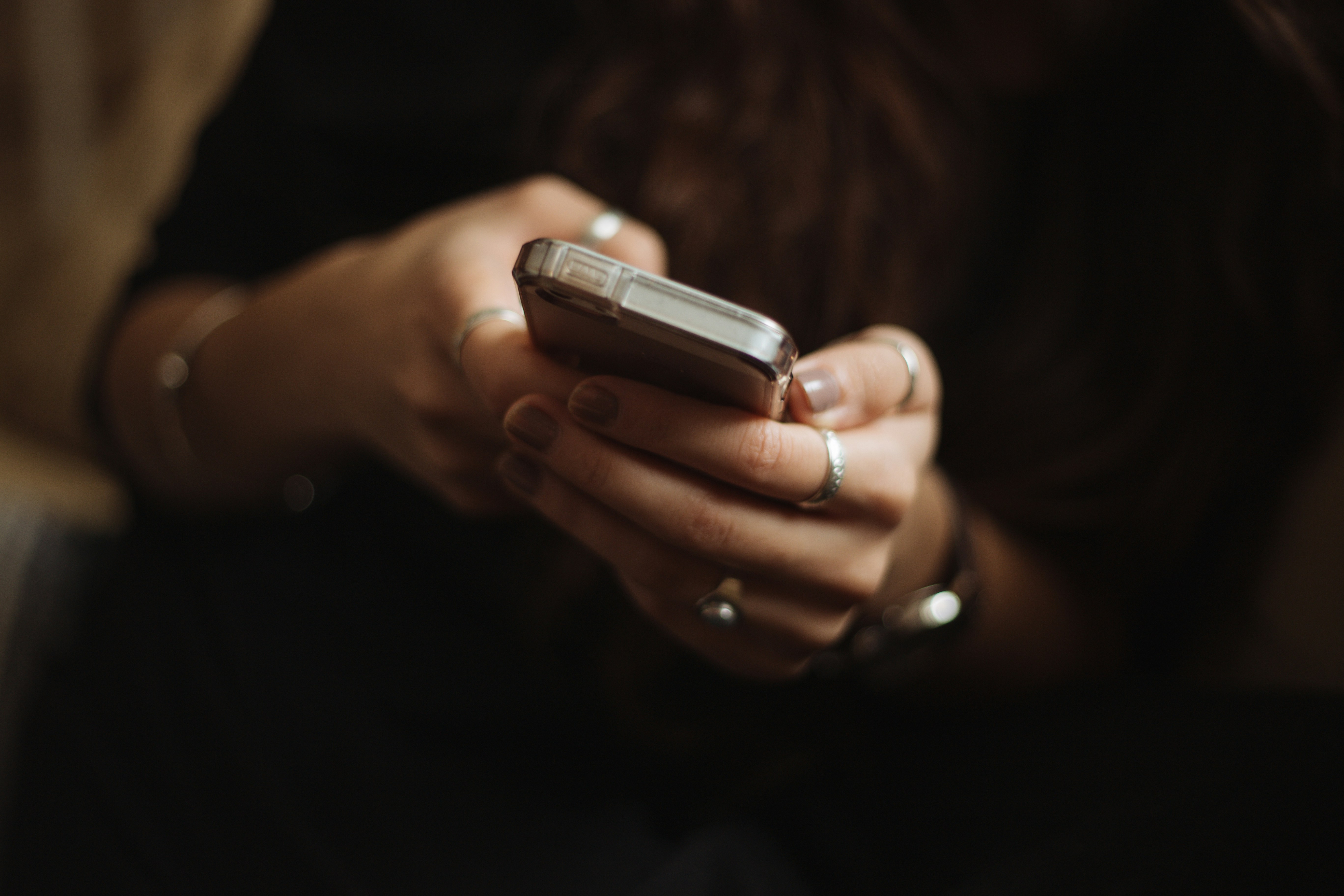 what is online reputation - image of mobile phone being held in both hands whilst searching the internet